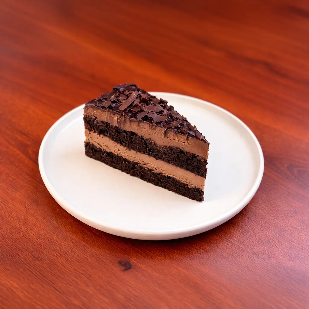 Belgian chocolate layer cake slice with rich dark chocolate sponge, chocolate mousse filling and chocolate shavings on top at Cafe Galata Guelph